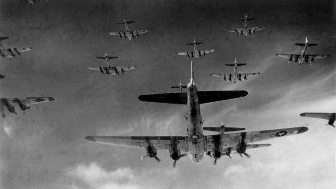 B-17 Flying Fortresses from the 398th Bombardment Group fly a bombing run to Neumunster, Germany, on April 13, 1945. Public domain.